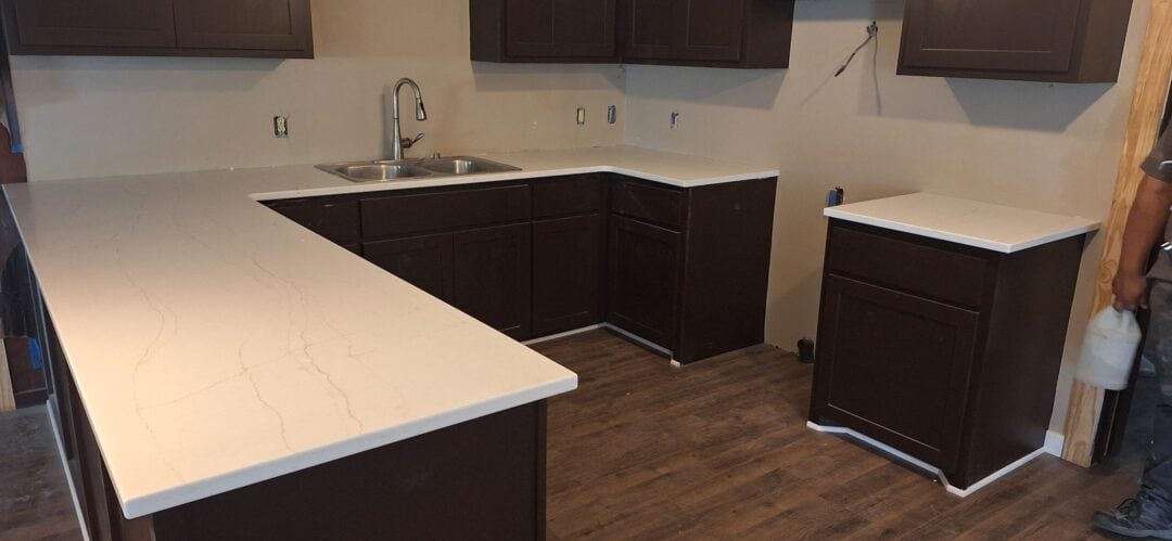 | R&D Marble, Inc. traditional kitchen with white quartz countertops
