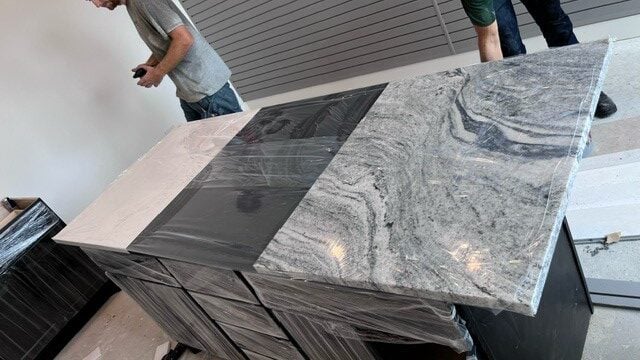 | R&D Marble, Inc. grey marbled quartz island with stove top