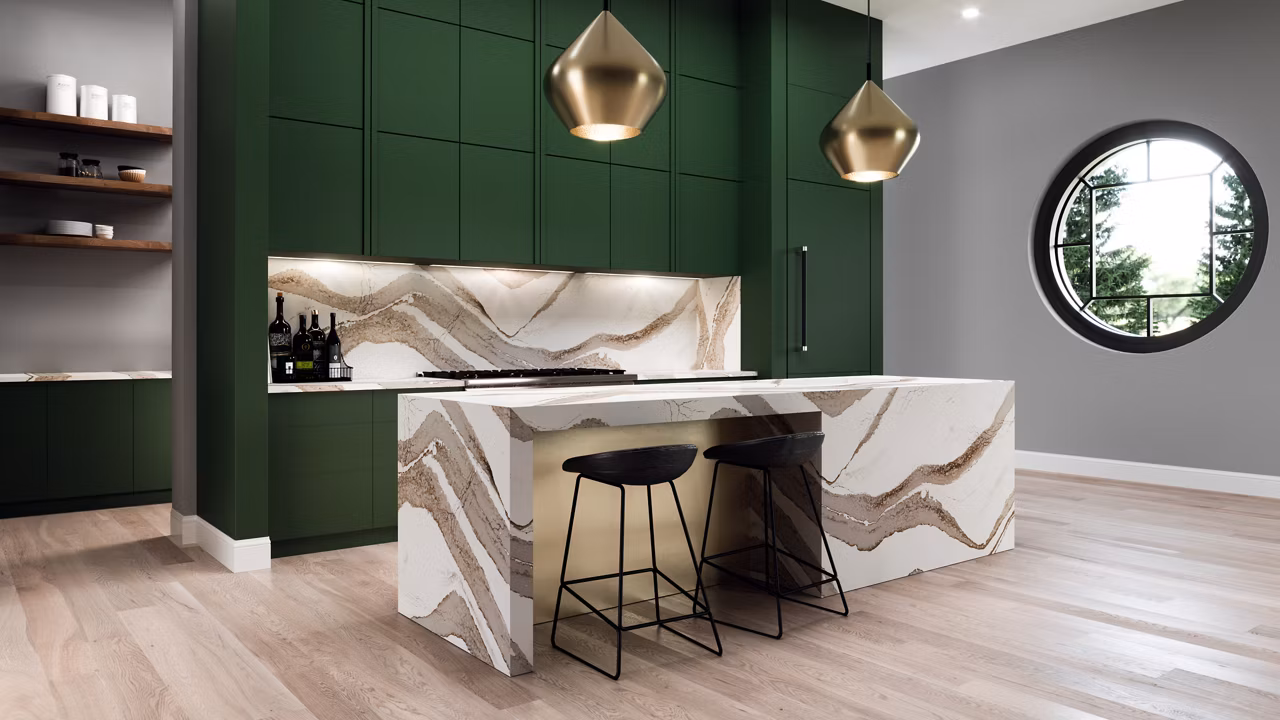 Beautiful quartz kitchen backsplash and island with green cabinets.
