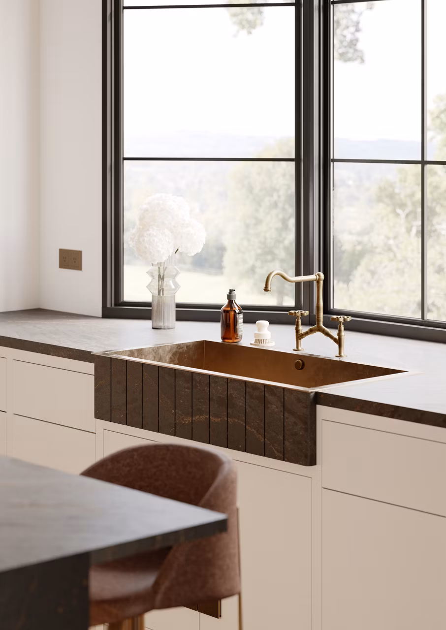 Rustic kitchen sink with Cambria's Remington brass satin.