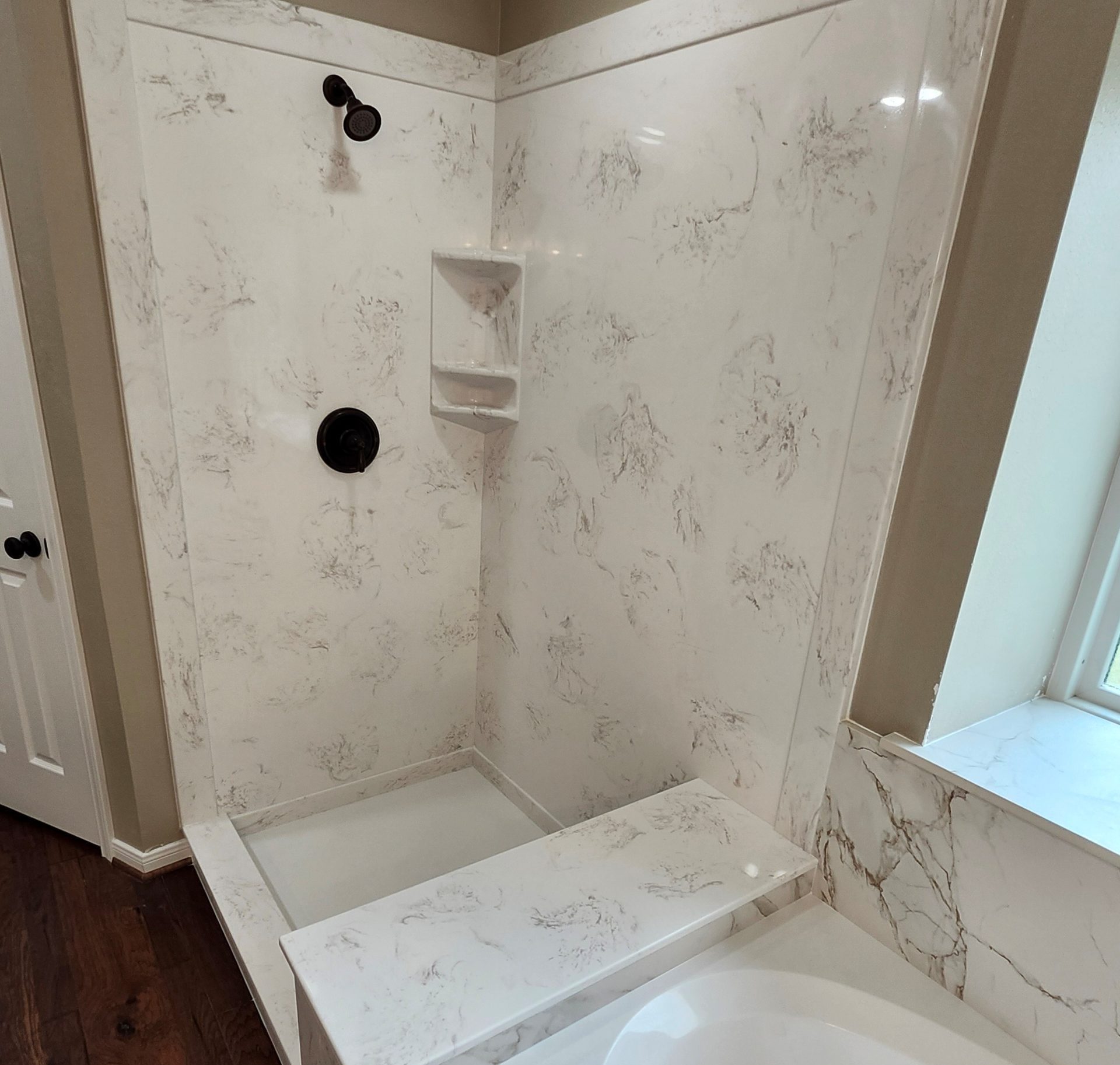 Cultured Stone Walls & Other Beautiful Stone Accessories Bathroom shower and tub remodel with cast polymer cultured marble walls.