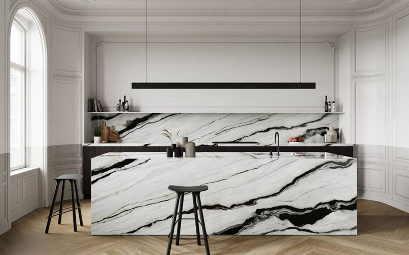 | R&D Marble, Inc. A white porcelain backsplash and island with black veining for a modern ktichen.