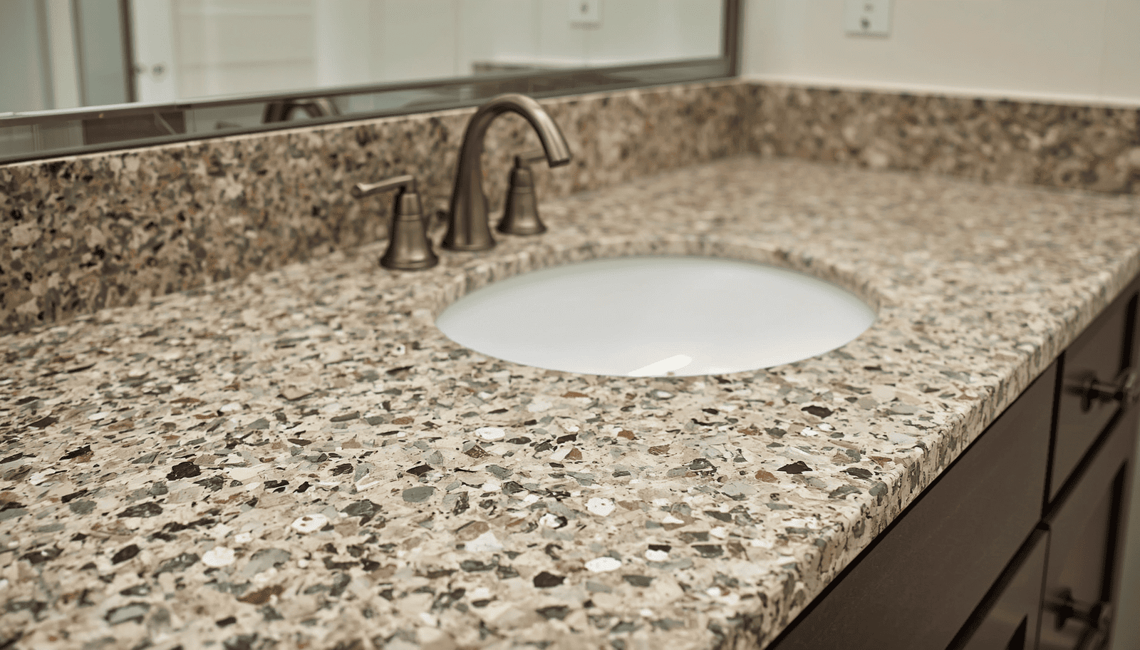 width_1600-1 | R&D Marble, Inc. Granite bathroom vanity with an oval sink and brushed nickel faucet.