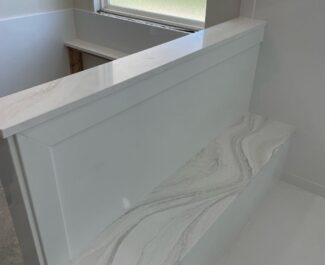 Cultured marble walls and Cambria Everleigh shower seat, shelves, and caps | R&D Marble, Inc. Cultured marble walls and Cambria Everleigh shower seat, shelves, and caps