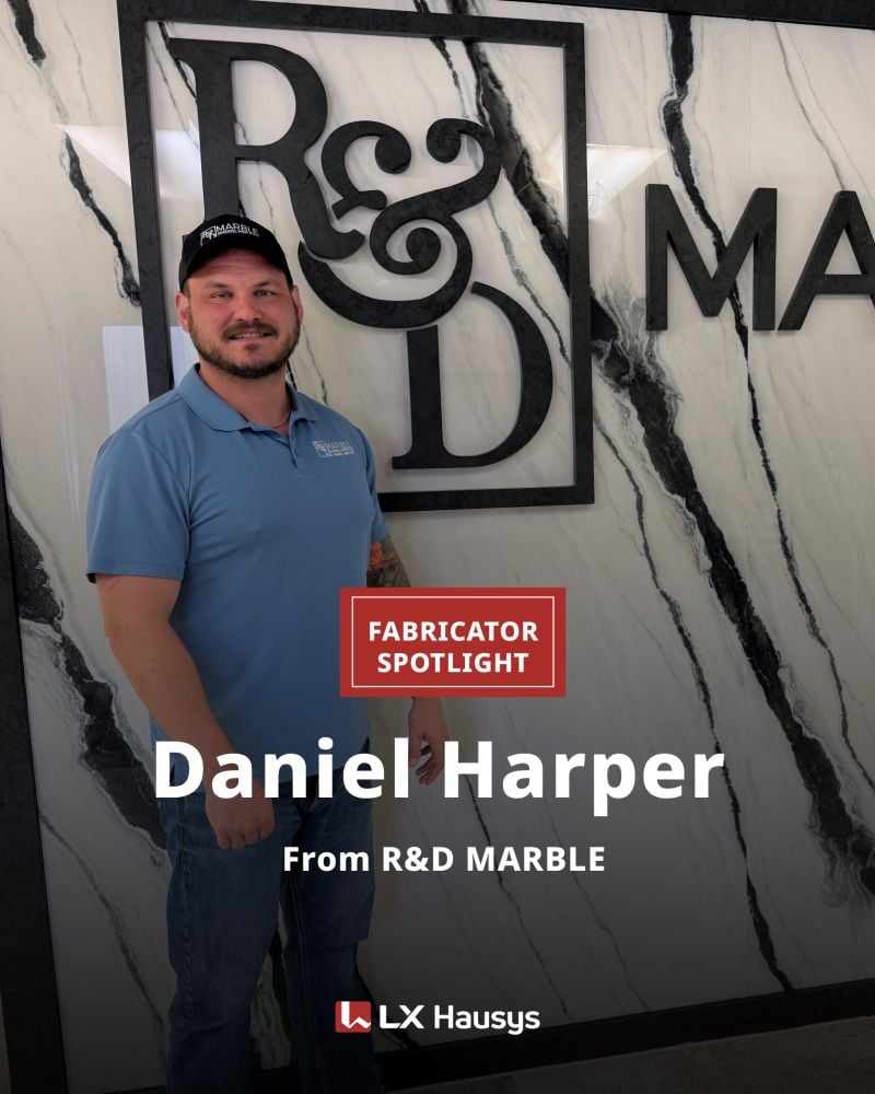 | R&D Marble, Inc. Portrait of Daniel Harper posing in front of a marble wall with R&D branding and 'Fabricator Spotlight' badge, from R&D Marble / LX Hausys