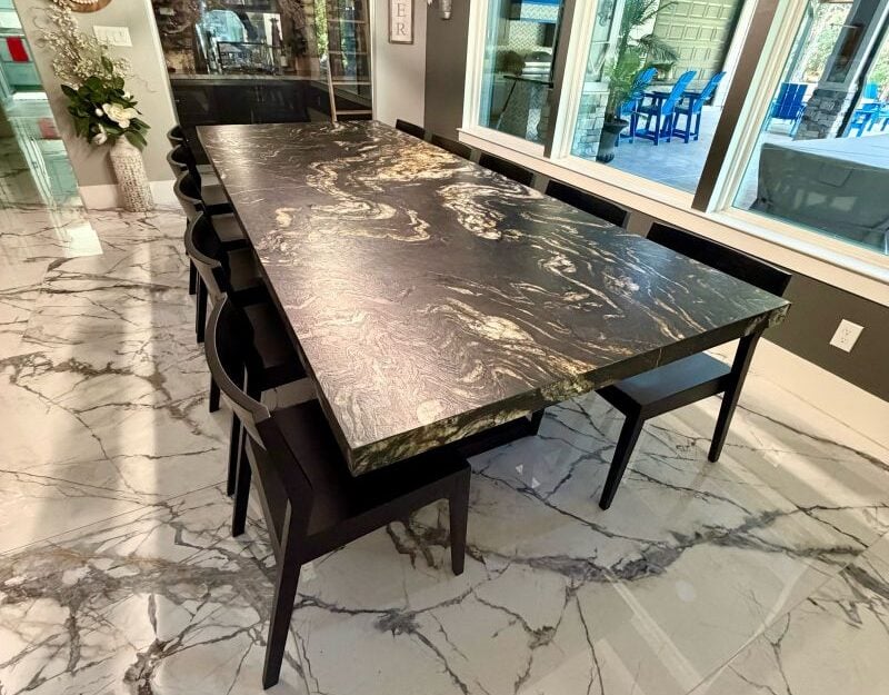 Cultured Granite vs Natural Granite: Key Differences Custom Cosmic Black natural stone dining table from Triton Stone Group installed by R&D Marble